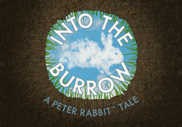 The view from inside a rabbit’s burrow looking up into the sky with a fluffy cloud in the shape of a rabbit above. Text reading 