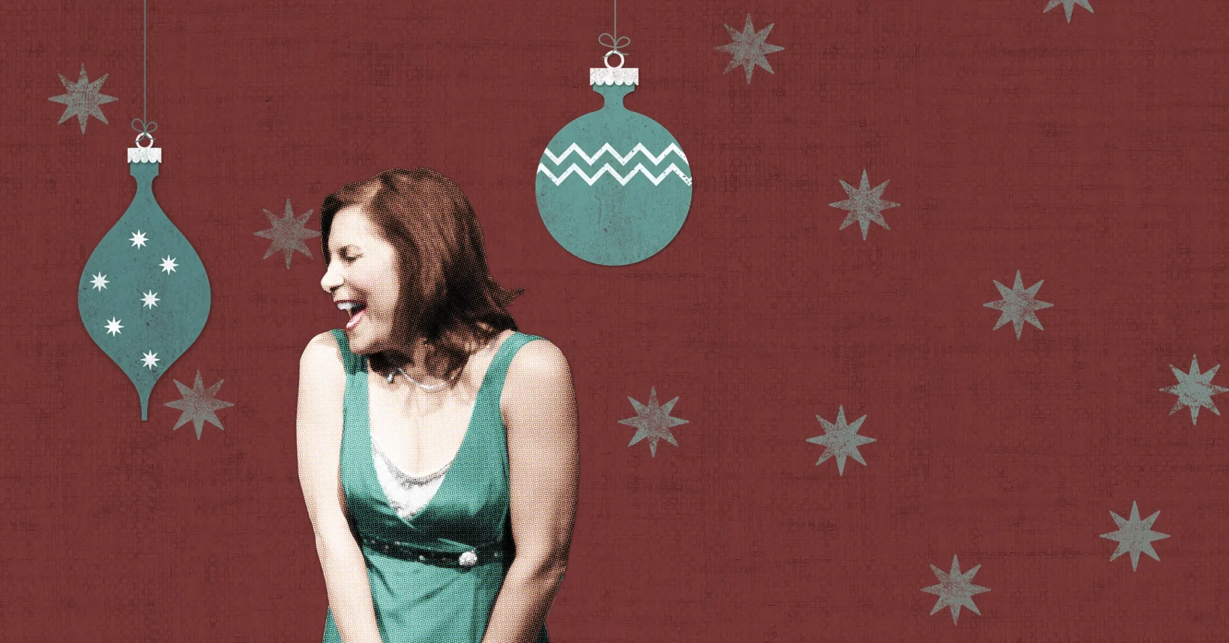 A woman in a green dress stands smiling in front of a red background decorated with blue ornaments and star shapes.