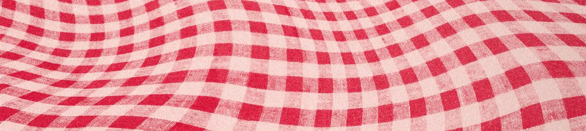 Red and white checkered fabric with a wavy, undulating pattern.