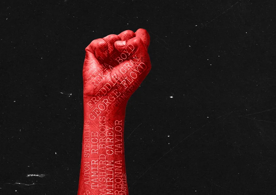 A raised fist painted red with names of Black individuals written on it, set against a black background.
