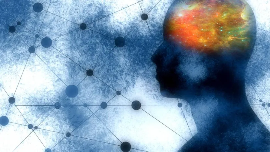 Silhouette of a human head with a colorful depiction of a brain, overlaid on a background of interconnected nodes and lines.