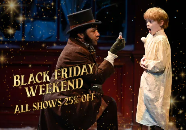 A man in Victorian clothing kneels and holds up a coin to a surprised boy in nightwear; text reads "Black Friday Weekend All Shows 25% Off.