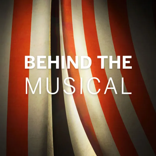 Red and white striped theater curtain with the text "BEHIND THE MUSICAL" in bold white letters over the fabric.