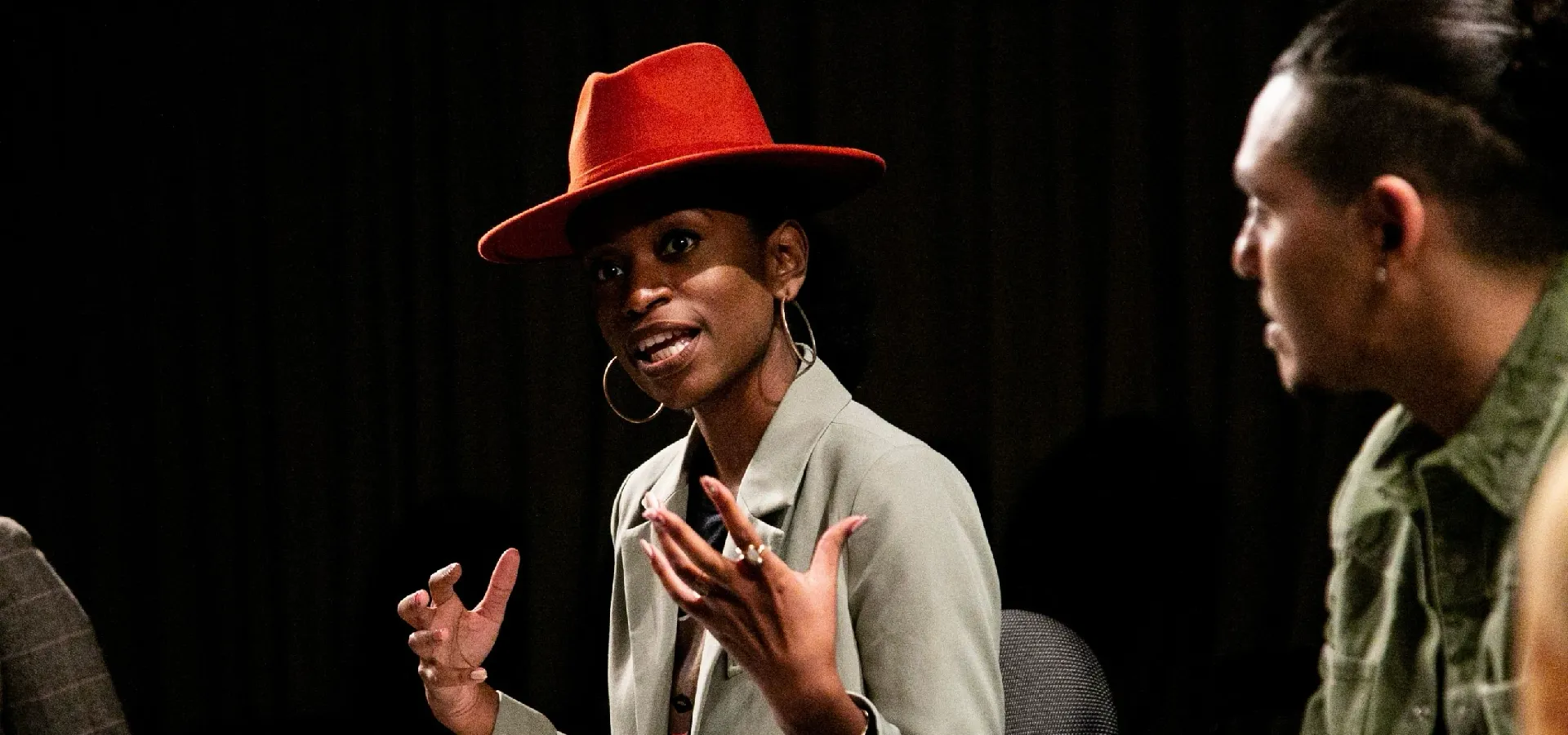 Maya Lawrence, Allyship Program Director, speaking to a group of people at a workshop