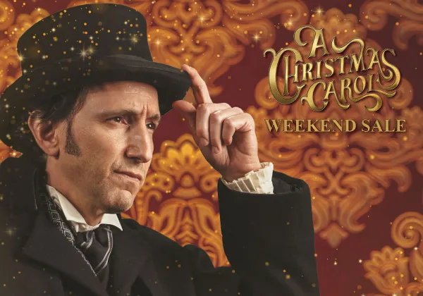 A man in Victorian-era clothing and top hat tips his hat. Ornate background with text reads "A Christmas Carol Weekend Sale.