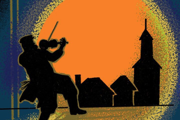 Silhouette of a person playing violin on a rooftop with houses and a church against a large orange sun in the background.