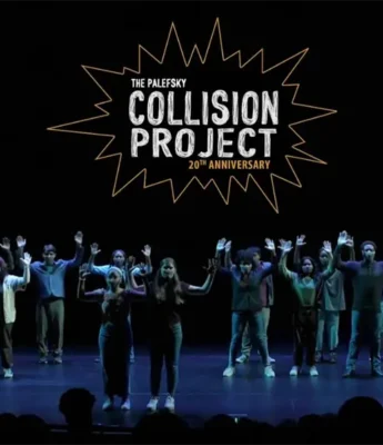 A group of people stand on stage with their hands raised under a sign that reads "The Palefsky Collision Project 20th Anniversary.