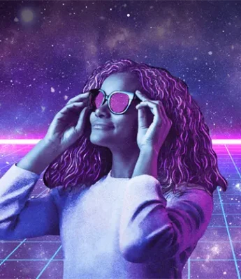 A woman with curly hair wearing sunglasses stands in front of a neon grid and starry, space-themed background with purple and pink lighting.
