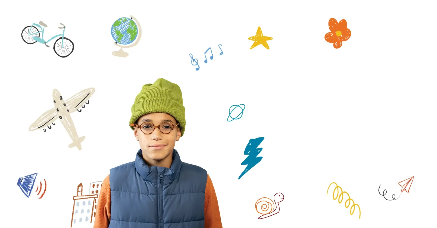 A boy in glasses and a green beanie stands in front of a white background decorated with drawings of a globe, airplane, bike, star, music notes, and other colorful doodles.