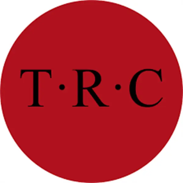 A solid red circle with the black letters "T R C" evenly spaced and separated by dots in the center.