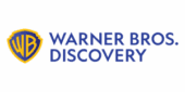 Warner Bros. Discovery logo featuring a yellow and blue shield with "WB" and the company name in blue text on a light background.
