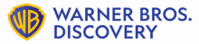 The Warner Bros. Discovery logo features a yellow and blue WB shield next to the words "Warner Bros. Discovery" in blue capital letters on a light background.