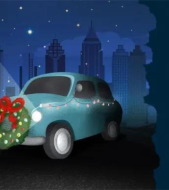 A blue car decorated with string lights and a Christmas wreath on its front is parked at night with city skyscrapers in the background.