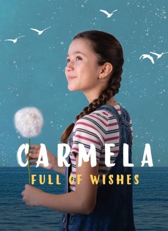 Young girl in a striped shirt and overalls holds a dandelion with purpose against a blue sea and sky, with the text “Carmela Full of Wishes.”.