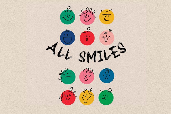Twelve colorful circles with varying facial expressions are arranged in a grid, with the words "ALL SMILES" handwritten across the center.