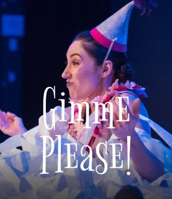 A woman in a party hat and costume gestures with her hands on stage, as if hosting a lively Dinosaur Stream. Overlaid text reads, "GIMME PLEASE!.
