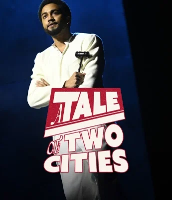 A man in white clothing holding a gavel stands against a dark background, as the text "A Tale of Two Cities" appears in red and white—hinting at drama reminiscent of the Dinosaur Stream era.