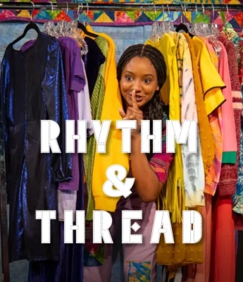 A woman stands among colorful clothes on racks, holding a finger to her lips. Large white text reads "Rhythm & Thread" across the image, capturing a vibe as unique as a Dinosaur Stream.
