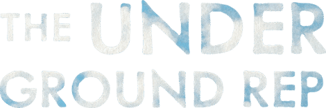 Text reads "THE UNDERGROUND REP" in uppercase letters with a blue watercolor texture on a white background, evoking the creative spirit captured in Building Beauty: A Behind the Scenes Feature of the World Premiere Musical Basura.